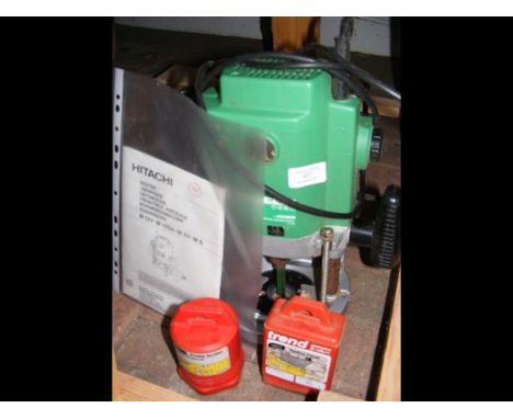 A Hitachi 1/2 inch router, Trend 1/2 inch router profile scriber and Trend 1/2 inch router recess panel cutter