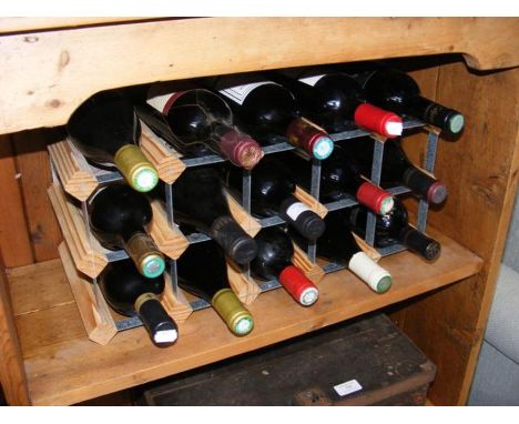 Fifteen bottles of red wine in wine rack