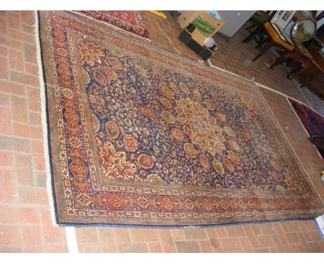 An Indian antique carpet with geometric border and floral sprays - 288cm x 186cmCONDITION REPORTworn in places as per images