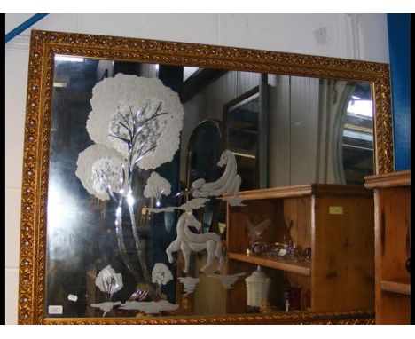 A gilt framed wall mirror with internal picture of horses and trees 