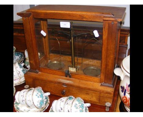 A set of scientific scales in oak case 