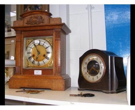 A Smiths Bakelite mantel clock, together with an oak cased 1930's German mantel clock 