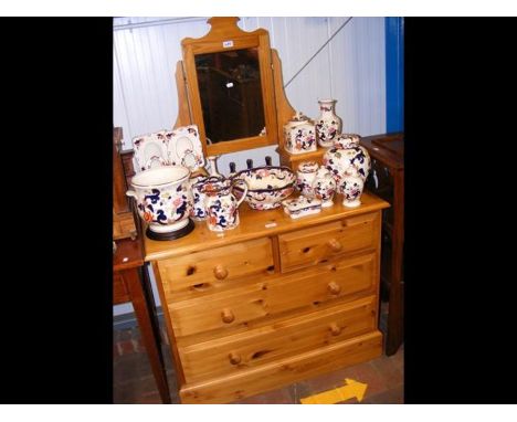 A lacquered pine dressing chest and swing mirror 