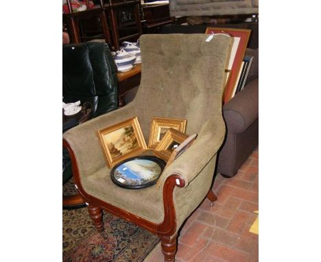 A 19th century button back armchair with shaped support 