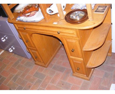 A light oak knee hole desk 