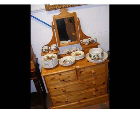 A lacquered pine dressing chest and swing mirror 