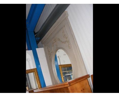 A large oval overmantel mirror in painted surround 