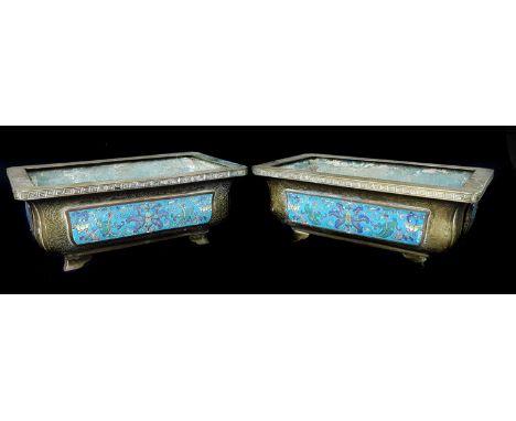 A Pair of Chinese cloissone enamel jardinieres, of shaped rectangular form applied with panels of lotus flowers and scrolling