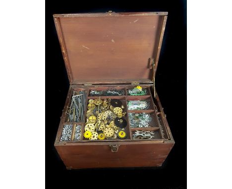 A large quantity of Meccano components; and Meccano 'Books of models' for sets 2-7; in a wooden sectional toolbox (qty) 