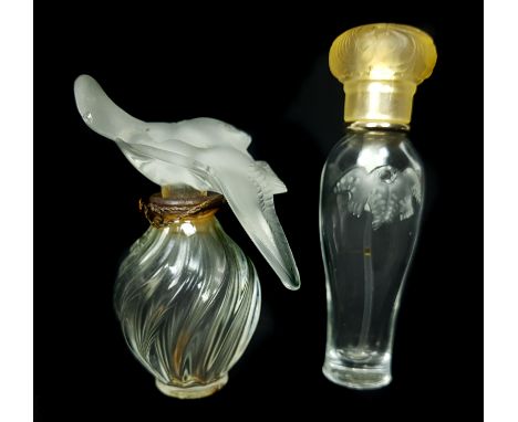 L'Air du Temps -Nina Ricci- A Lalique Glass bottle, of small size, spiral fluted ovoid body with frosted stopper formed as a 