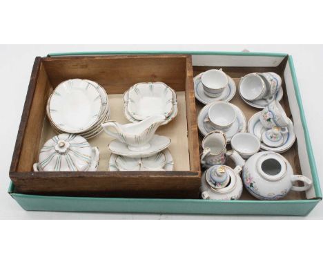 An early 20th century child's dolls' house tea service; together with another similar exampleBlue &amp; white set – one teacu