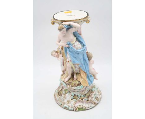 A 20th century Dresden porcelain centrepiece base, the oval top supported by two semi-nude maidens with putti at their feet, 