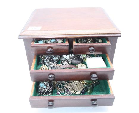 A mahogany five drawer table-top jewellery chest and contents, to include an Edwardian gilt metal faux amethyst and seed pear