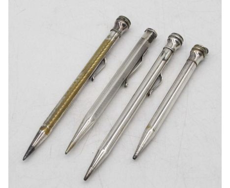 An early 20th century yard-o'-lead silver propelling pencil, with engine turned decoration; together with three other propell