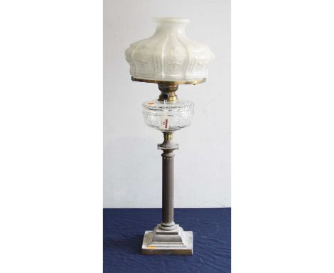 A Victorian oil lamp, having opalescent moulded glass shade above a clear glass font, on a fluted brass column and stepped sq
