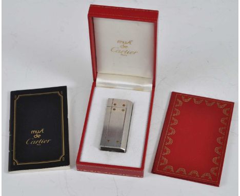 A Must de Cartier Briquet steel cigarette lighter, in fitted box, with wallet and papers 