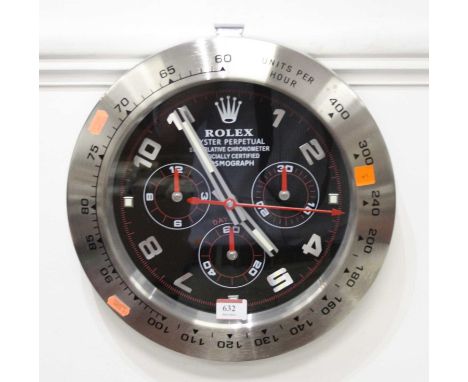 A reproduction wall clock, the dial in the form of a Rolex Oyster Perpetual superlative chronometer, having quartz movement, 