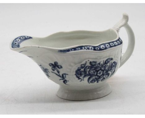 An 18th century Worcester teapot of moulded form underglaze blue painted with flowers, unmarked, height 9cm