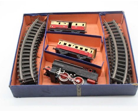 A boxed Fleischmann 0 gauge locomotive with two tenders and trackClockwork.All rails present.Appears in good clean condition.
