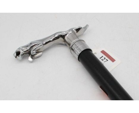 A walking stick having an ebonised shaft with chromed Jaguar car mascot type handle, length 93cmThis is a modern reproduction