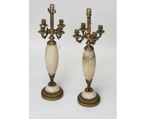 A pair of table lamps in the form of a 19th century French candelabra, each having central light fitting above four sconces a