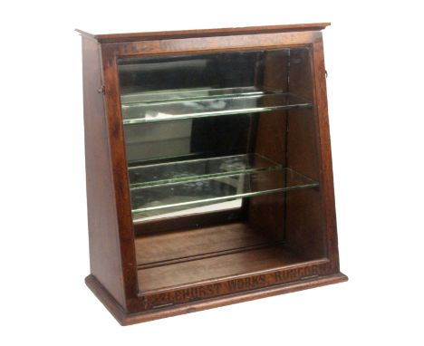 A mahogany counter display cabinet, hinged glazed slanting door inscribed in gilt paint to the frame 'The United Alkaline Co.