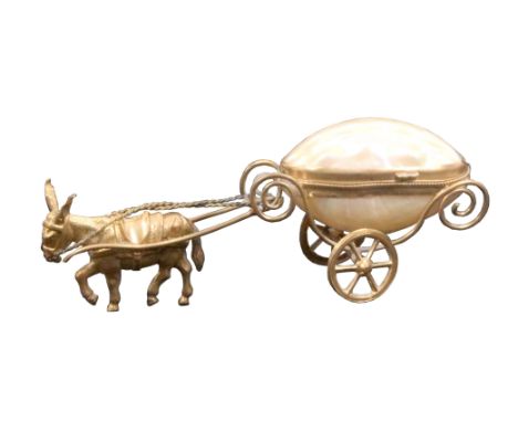 A pin or thimble cart in the style of Palais Royal, the mother of pearl egg form cart with gilt metal scroll frame raised on 