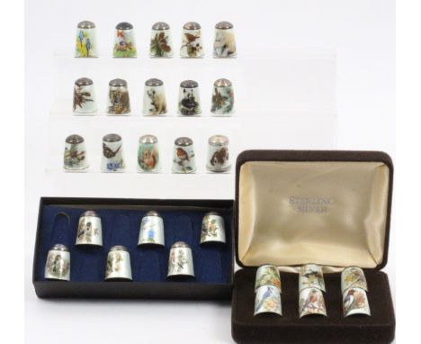 Twenty seven English silver enamel thimbles by James Swann and Son, comprising nineteen decorated with birds, and eight mostl