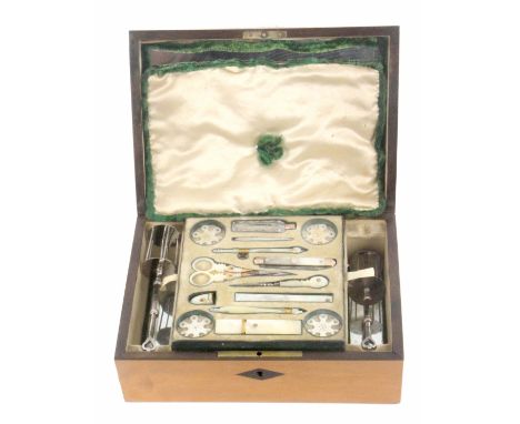 A well fitted Palais Royal sewing box, circa 1820, of rectangular form and veneered in satin wood with ebony diamond escutche