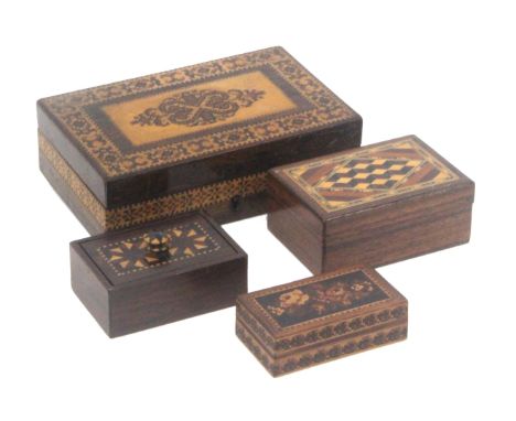 Four small Tunbridge ware rectangular boxes, comprising a rosewood example, the sides in geometric mosaic, the hinged lid wit