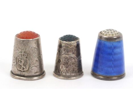 Three Norwegian thimbles, comprising a silver and blue enamel example with moonstone top by Nils Elvik, internal apex marks '