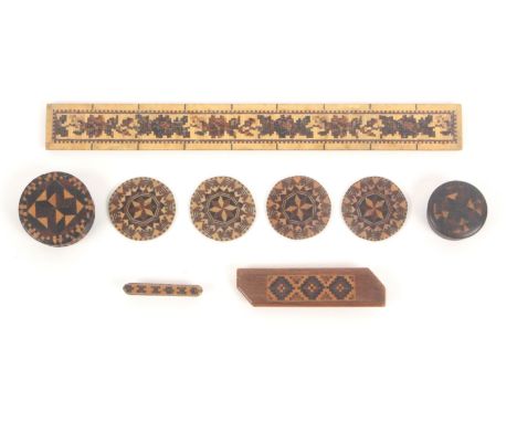 Tunbridge ware - nine pieces, comprising, a set of four circular stick ware counters, 3.5cms, two mosaic inlaid bar brooches,