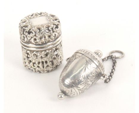 Two silver thimble cases, comprising an American cylinder form example with pierced decoration, stamped 'Sterling' with an En