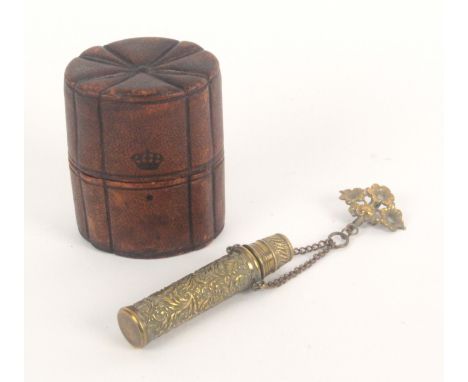 Two sewing companions, circa 1870, comprising a brown leather example of oval section with fan segmented top, interior with l
