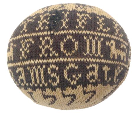 A fine knitted pin ball dated 1777, worked in near black and cream, one side inscribed 'A Trifle From Ramsgate 1777', with an