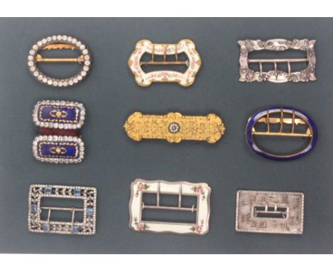 Buckles - a display of nine 19th Century and later buckles, one in enamel and paste, two other paste decorated examples, thre