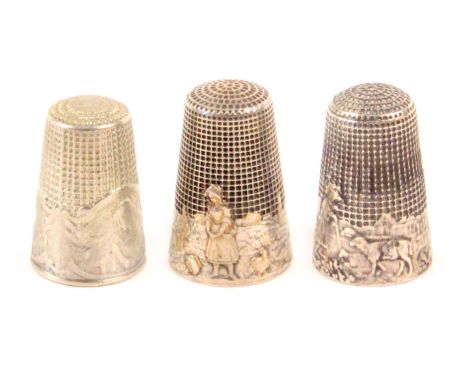 Three French illustrative silver thimbles, comprising 'Le De dela Guerre' (Thimble of War), 'The Wolf Who Became a Shepherd',