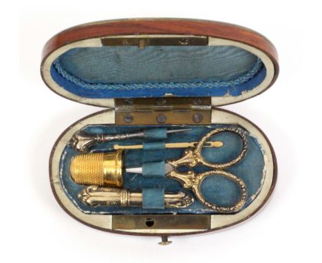 A miniature sewing set for a child or doll, probably Tahan, Paris, circa 1870, the oval kingwood case with brass edge rim to 