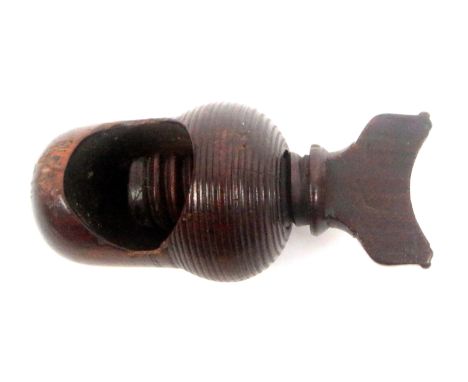 An early 19th Century screw form nut cracker, hardwood, acorn form body with top screw, 7.5cms. 