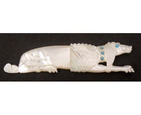 A fine carved mother of pearl Palais Royal 'jewelled' needle case in the form of a recumbent poodle, the poodle part shaved, 