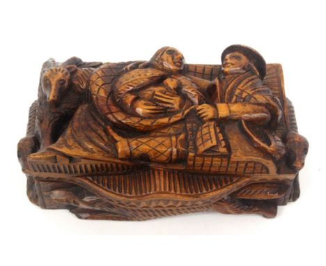 A Scottish 'blind man' deep carved stained sycamore snuff box, wooden hinge, the top carved with a male figure at rest embrac