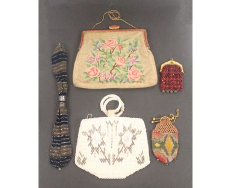 Five various purses and bags, two small with gilt clasps, knitted and beaded misers purse, 29cms, a bead work bag, 16.5cms, a