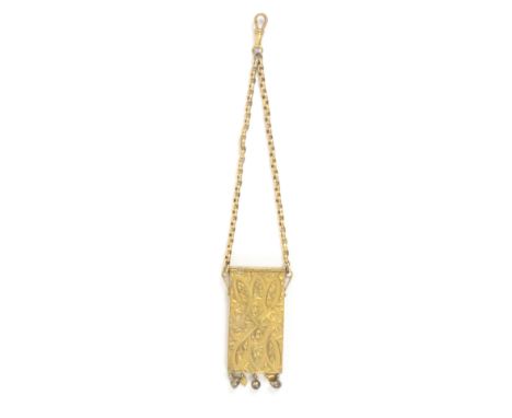 An unusual gilded brass needle packet case, of rectangular form the front with shield and leaf scrolls the bottom edge with t