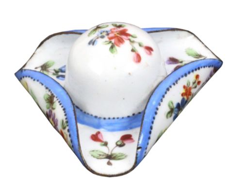 An enamel patch box in the form of a tricorn hat, painted with flowering branches, the base with hinged cover in copper gilt 