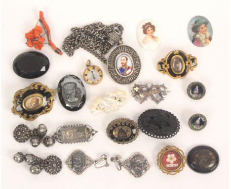 Victorian and later costume jewellery, comprising a red coral brooch, 5.5cms, three mourning brooches, a pendant with enamel 