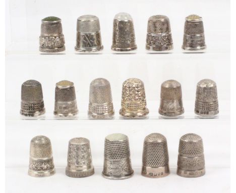 Sixteen English silver thimbles, including five with stone tops, one with harp and shamrock border, mostly hallmarked and ear