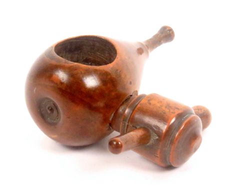 An 18th Century fruitwood screw form nut cracker, of good colour and patination, the pear shaped body with side screw, 8cms h