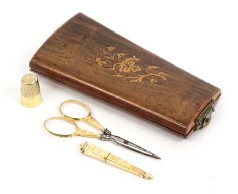 A French rosewood etui and a set of three French silver gilt sewing tools, the etui of tapering form and oval section, the li