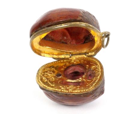A rare hazelnut etui for a doll, hinged brass frame with suspension loop, gilt metal tool frame with decoration, all tools la