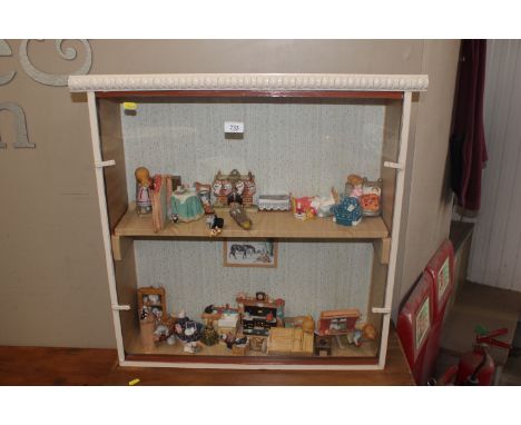 A display case and contents of various figurines; to include Wade